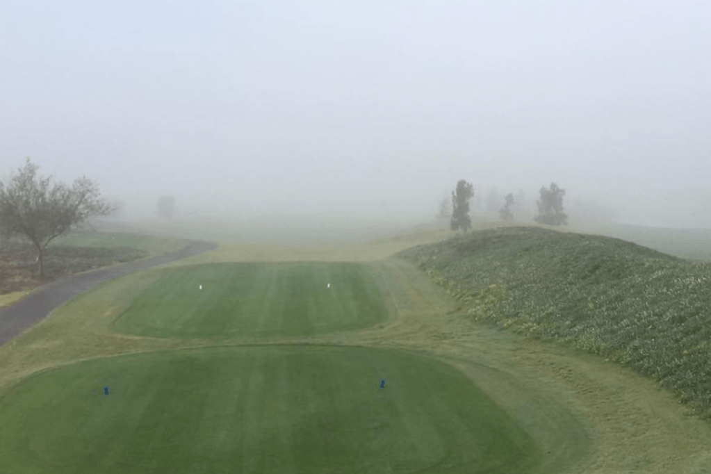 golf course with fog